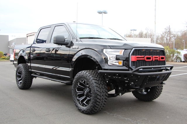 Black Custom Lifted F-150 with Red Grille at All American Ford of Hackensack in Hackensack NJ