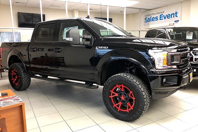 Black F-150 with Jimmie Allen Red Rims at All American Ford of Hackensack in Hackensack NJ